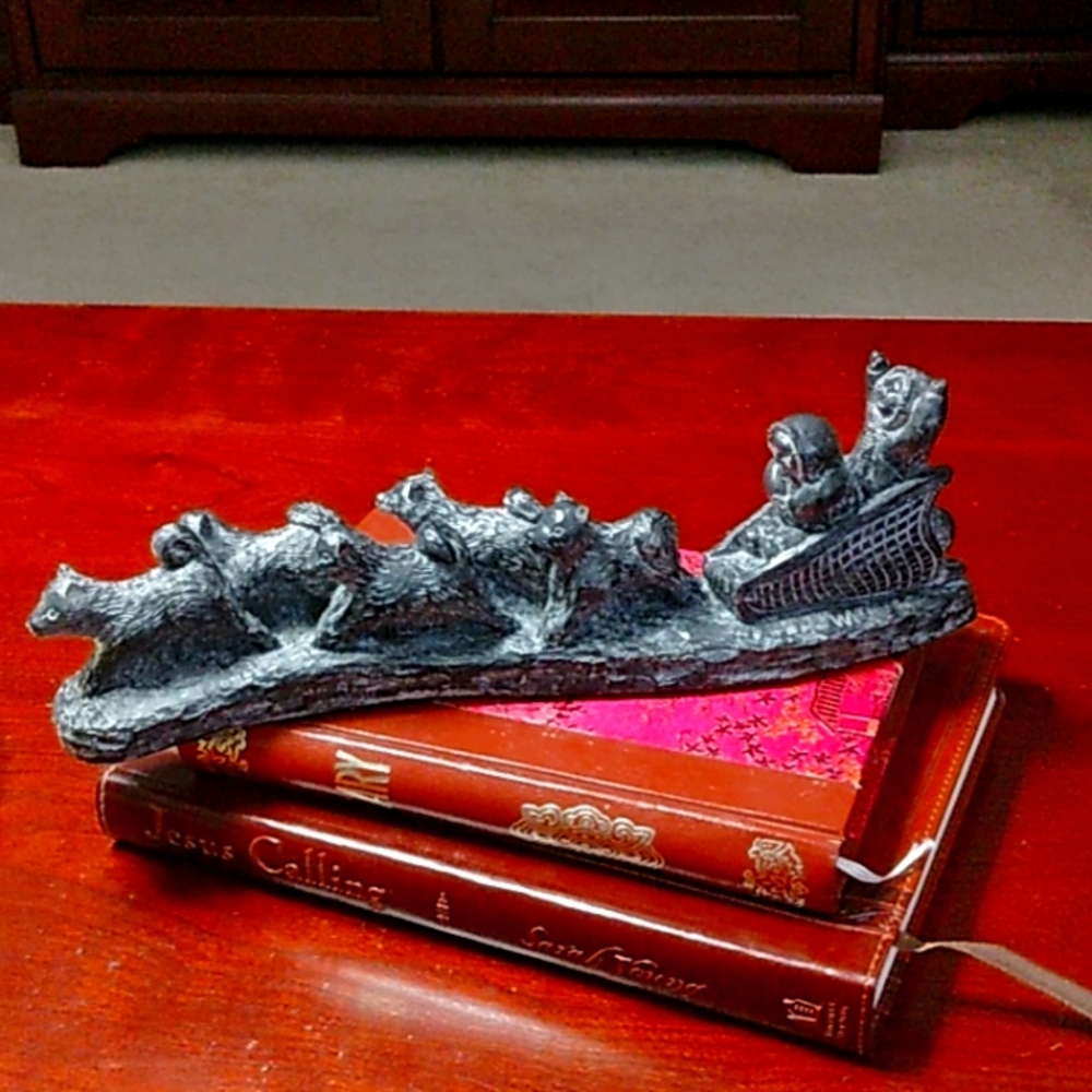 Al Wolf's original stone sculpture of a dog sled team, Vintage (1980s).